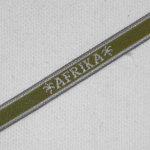 Product image of the product “Ärmelband Afrika braun mit weisser Schrift ”